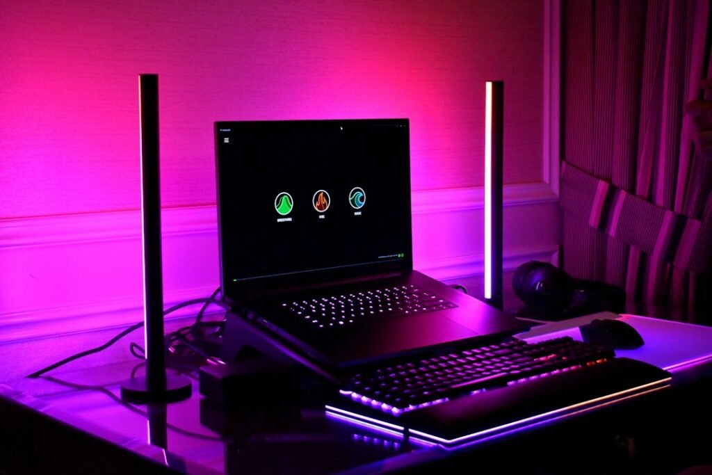 Colorfully illuminated desktop gaming and development workstation, representing a Three.js browser game tutorial